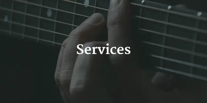 A photo of a hand playing a guitar with the text "Services" super-imposed over it.